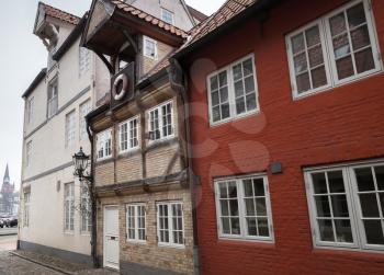 Street view with traditional colorful living houses in old town Flensburg, Germany