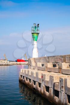 Green and white lighthouse tower in Burgas port, Black Sea coast, Bulgaria