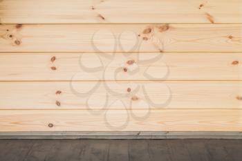 Wooden wall and floor background. Empty interior, frontal view