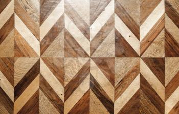 Natural wooden parquet flooring design, geometric pattern. Front view, Background photo texture