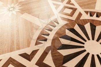 Vintage wooden parquet with classical pattern. Background texture