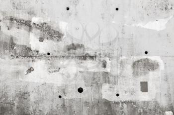 Gray concrete wall with white paint layer, flat background photo texture