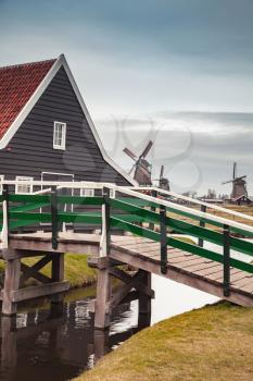 Wooden bridge and barn. Zaanse Schans town, popular tourist attractions of the Netherlands. Suburb of Amsterdam