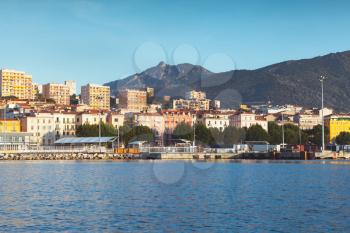 Port of Ajaccio, seaside photo. Corsica, French island in the Mediterranean Sea. Summer morning cityscape with vintage tonal correction filter effect