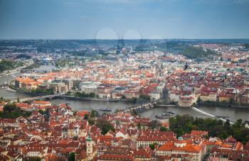 Prague old town. Bridges over Vltava river in summer day. Aerial photo