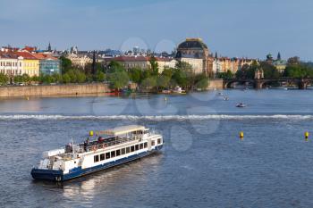 Passenger ship on Vltava river, Prague at summer day. Czech Republic