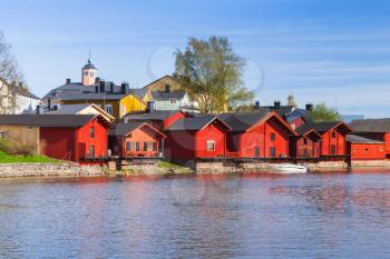 Porvoo town, Finland. Old red wooden houses in a row on river coast