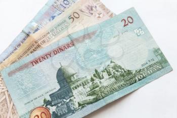 Jordanian dinars, banknotes lay on a white background