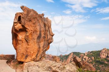 Huge stone stands on a roadside in Calanques de Piana. Corsican rocks located in Piana, between Ajaccio and Calvi, in the gulf of Porto