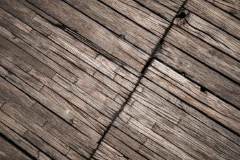 Old dark brown outdoor wooden floor, background photo texture