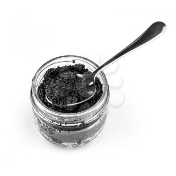 Black caviar in a glass jar with teaspoon isolated on white background