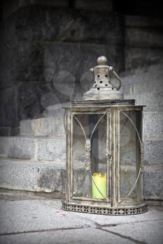 Old vintage lamp with candle inside