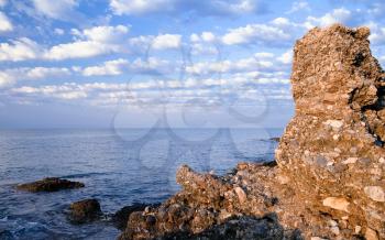 Sandstone cliff on the coast of Mediterranean Sea. Avsallar, Alanya, Turkey