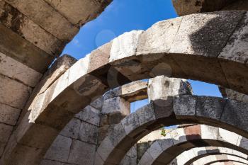 Ruined stone corridor with arches. Ruins of Ancient city Smyrna. Izmir, Turkey