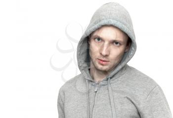 Young Caucasian man in gray jacket with hood. Portrait isolated on white