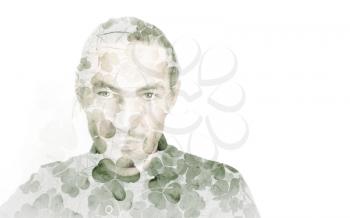 Portrait of young man combined with natural green wild clover leaves background, double exposure photo effect