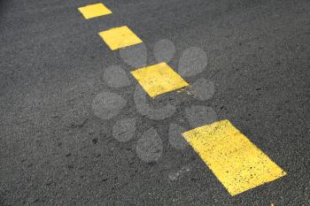 Pedestrian crossing road marking, yellow striped lines on asphalt