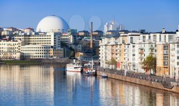 Cityscape with modern living houses in Stockholm. Sodermalm district, Masthamnen embankment. Stockholm Globe Arena on a background