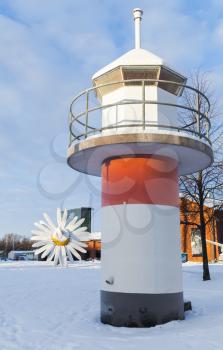 Red and white lighthouse tower. Port of Turku, Finland in cold winter day