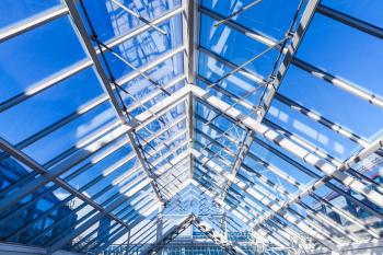 Abstract high-tech architecture background photo, internal structure of glass roof with lockable windows sections