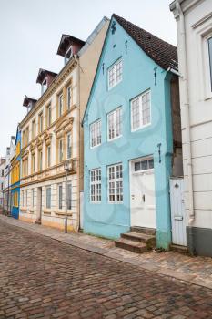 Vertical cityscape. Traditional colorful living houses along the street in old town of Flensburg city, Germany
