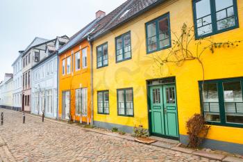 Traditional colorful living houses along the street in old town of Flensburg city, Germany