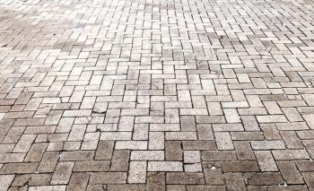 Gray cobblestone road pavement, background photo texture