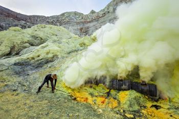 Sulfur miners inside crater of Ijen volcano, East Java, Indonesia