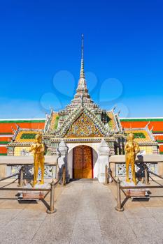 Guardians at the exit of Wat Phra Kaew Temple in Bangkok, Thailand