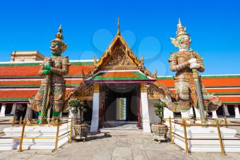 Thotsakhirithon giant demons guarding an exit of Wat Phra Kaew Temple in Bangkok, Thailand