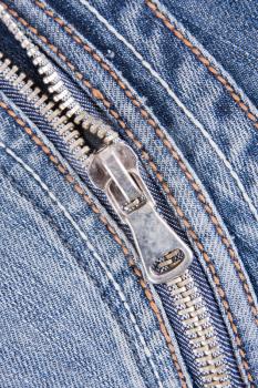 Close-up of zipper on denim blue jeans