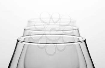 Three empty cognac glasses in a row