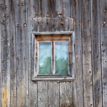 Old window on wooden house