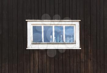 Old window on rural wooden house