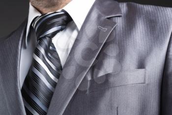 Close up of businessman in modern office suit