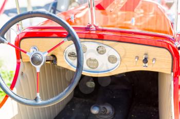 Rudder of a red vintage car close up