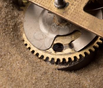 Mechanical endurance - clock gears in sand