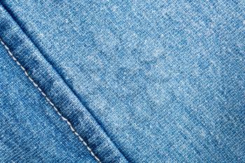 A closeup of jeans fabric with seam