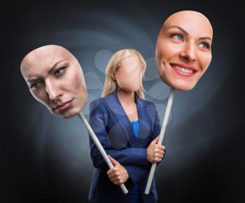 Businesswoman choosing face over grey background