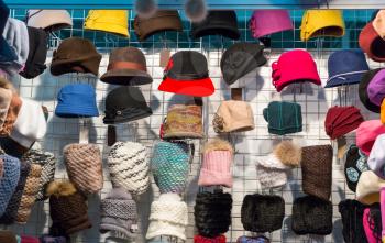 Showcase in women hat shop, fabric textile, colorful headwears