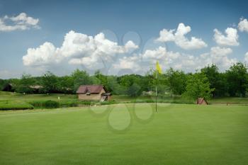 Trimmed field and sand bunkers for game on golf course, nobody. Green meadow in golfing club, playground in sunny day