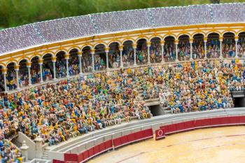 People on tribunes of the famous arena, miniature scene outdoor, europe. Mini figures with high detaling of objects, realistically diorama