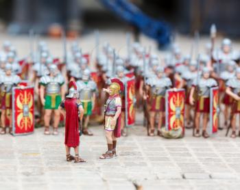 The army of roman soldiers, war miniature scene outdoor, europe. Mini figures with high detaling of objects, realistically diorama, toy model