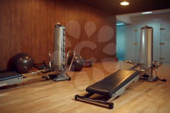 Exercise machine for pilates training in gym, nobody. Equipment for fitness workuot in empty sport club. Aerobics indoors
