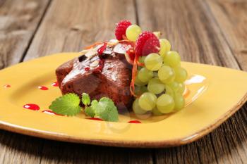 Gingerbread cake garnished with fresh fruit