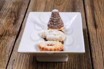 Homemade Christmas cookies on a white ceramic plate