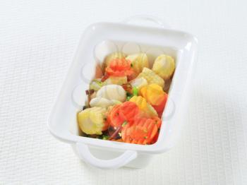 Mixed vegetables in a white porcelain dish