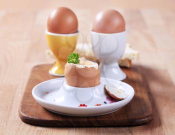 Boiled eggs in porcelain egg cups