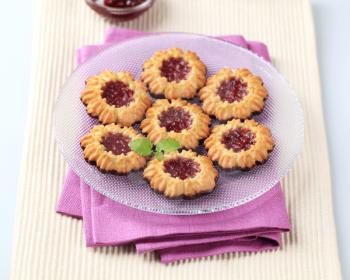Chocolate dipped butter cookies with jam center