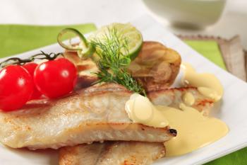 Pan fried fish fillets and Hollandaise sauce